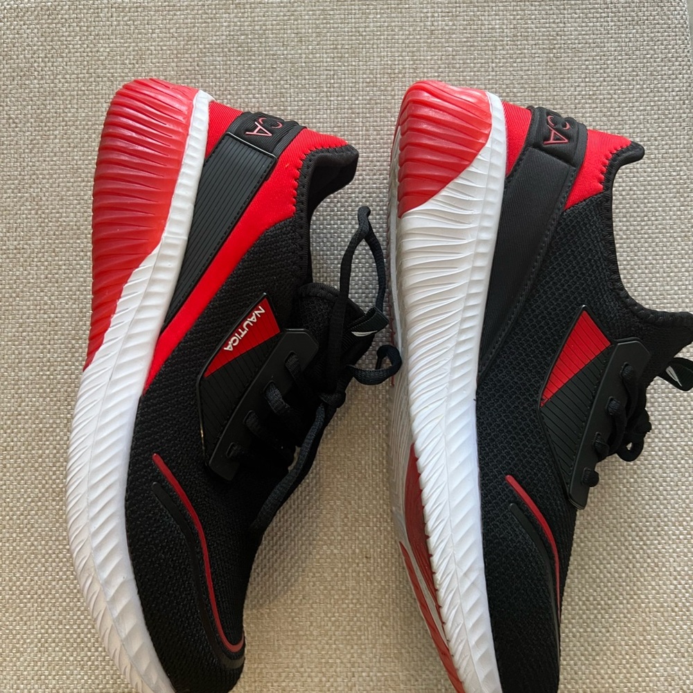 These are Nautica Men's Vintro black, red, and white slip-on lace-up sneakers 10